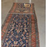 A caucasian runner, retailed by Harvey Nichols, one patch restored, 545cm long 102cm wide
