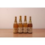 Four bottles of vintage French white wine, including a bottle of Macon 1977, Macon 1983 and two