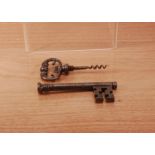 A novelty corkscrew in the form of a key, 20.5cm in length, the handle un screws to reveal a