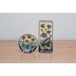 Two items of Moorcroft pottery Hepatica pattern 1999, comprising a coaster, 12cm diameter and a tray