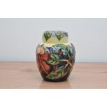 A Moorcroft pottery ginger jar and lid, Simian pattern, 16.5cm high