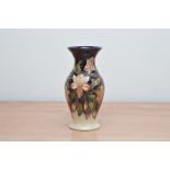 A Moorcroft pottery vase, Pearl' pattern, 19cm high, in a retail box