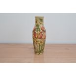 A Moorcroft pottery vase, Iris' pattern, 26cm high, in a retail box
