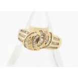 An 18ct yellow gold diamond set knot dress ring, baguettes and brilliant cuts, ring size M, 4.6g