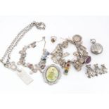 A collection of silver and white metal jewels, including a silver charm bracelet, set with various