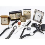 A c1960s Bucherer travel timepiece and other items, in black case with clock and calendar,