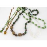 An Art Deco opalescent glass graduated necklace, together with a green oval bead and fresh water