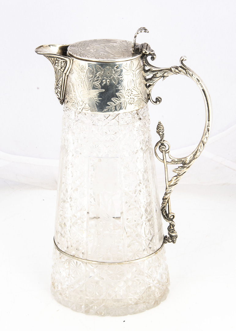 A Victorian cut glass and silver mounted claret jug by William Hutton & Sons, 27cm, chipped to base,