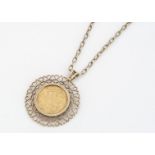 A Victorian full sovereign coin, dated 1899, mounted in a pierced mount and chain, 28cm together,