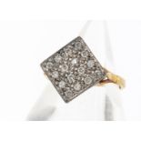 A diamond set brilliant cut tablet dress ring, the lozenge shaped tablet encrusted with brilliant