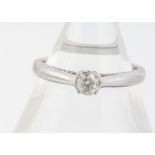 A diamond 9ct white gold solitaire ring, brilliant cut claw settings, with diamond set gallery, ring