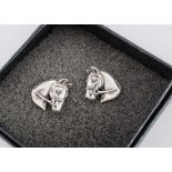 A pair of silver horse head ear studs, with post backs, marked 925 to posts