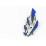 A contemporary silver and enamel brooch, oval shapes with bead pierced decoration, in green and blue