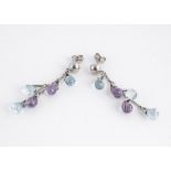 A pair of 18ct white gold chandelier amethyst and topaz ear drops, the faceted pear shaped ear drops
