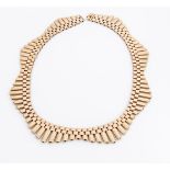 A 9ct gold fringe necklace, the square and rectangular hollow links, of wave design, marked to clasp