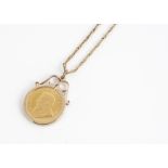 A 1980s 1/10th Krugerrand pendant and chain, mounted in 9ct, on a tapered linked chain, 25 cm