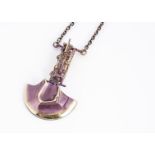 A Lapponia 'General Motors' pendant and chain, designed by Bjorn Weckstrom in petrol purple and