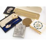 A collection of compacts and various coins, including a pewter hip flask with hunting scene, A