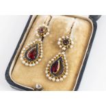 A pair of late 19th century French enamel, seed pearl and gem set ear drops, of oval shape with pear