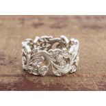 An 18ct white gold and diamond set eternity ring, of floral design, the leaves and flower heads