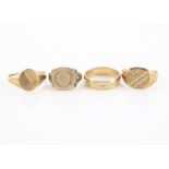 A collection of 9ct gold rings, including two signet rings, a wedding band and a coin ring, 14g