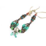 A North African turquoise, coral, white metal and bead necklace, 47 cm together,