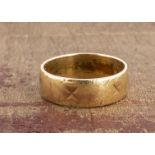 An 18ct gold wedding band, with engraved pattern, now worn, 5.9mm, ring size M, 4.7g