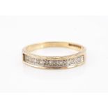 A 9ct gold half hooped diamond set dress ring, channel set eight cuts in a sunken setting, ring size
