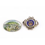 A oval base metal and enamel 1924 Empire Exhibition brooch circa 1924, together with a George IV