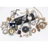 A silver charm bracelet, set with big ben, musical notes, wishing well and others, together with