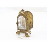 A continental gilt metal miniature jewel casket, of domed shape with hinged door with bevelled