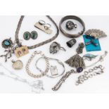 A collection of silver and white metal costume jewels, including a abalone and 925 marked bell