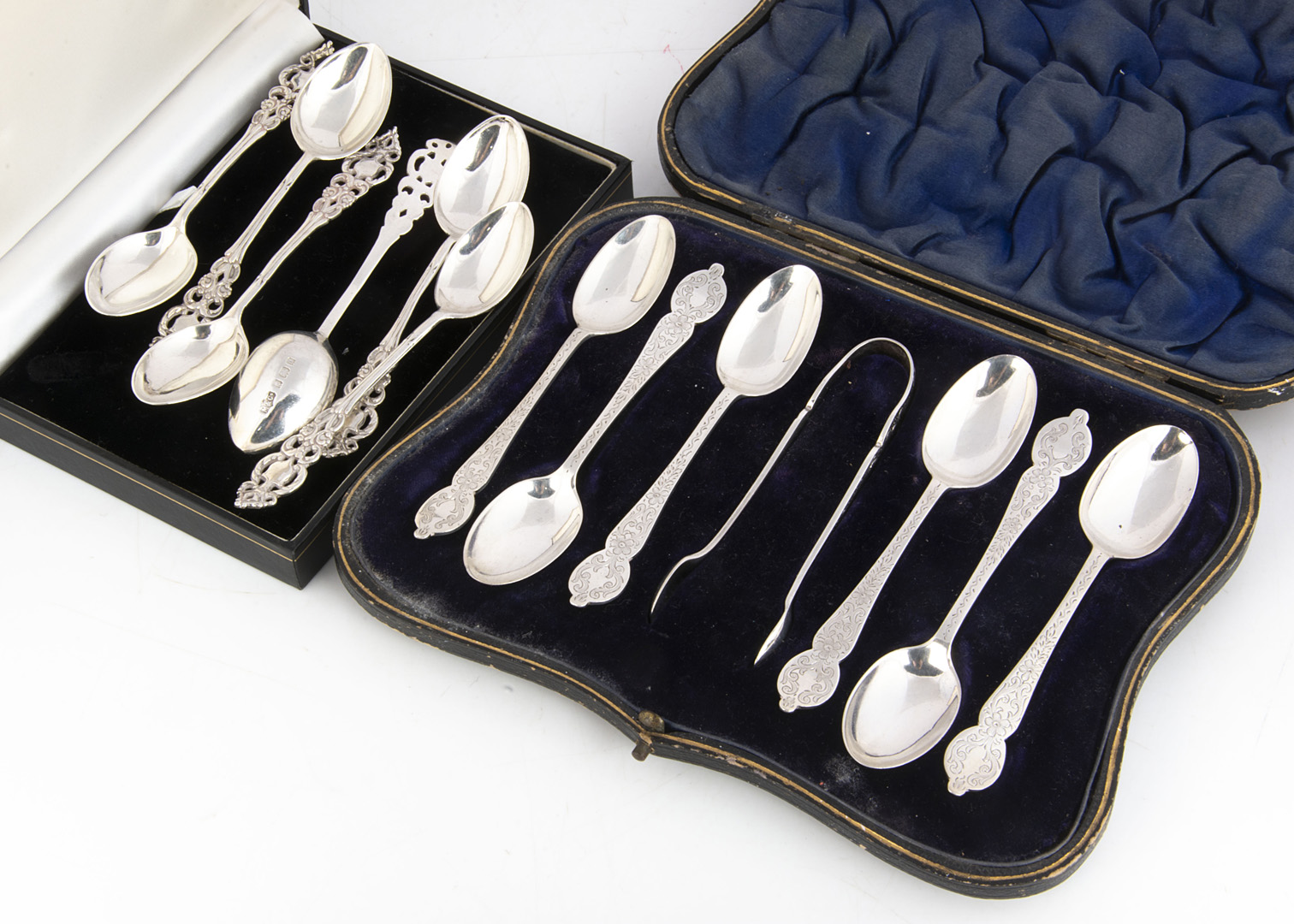 A Victorian cased set of six silver spoons and sugar tongs set by William Hutton & Sons, together