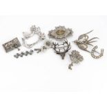 A paste set flower brooch, together with a marcasite exotic bird brooch, an Art Nouveau style