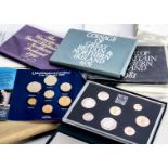 Five 1980s Royal Mint Deluxe proof sets, together with several UK proof and incirculated coin sets