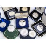 Nine silver commemorative coins, from the Royal Mint and various commonwealth countries, all boxed