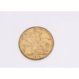 A George V gold full sovereign, dated 1915, VF but appears to have been in a mount