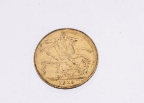 A George V gold full sovereign, dated 1915, VF but appears to have been in a mount