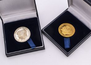 Two modern London Mint commemorative medallions, one a 9ct gold 2005 prototype for HRH The Prince of