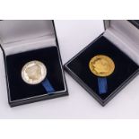 Two modern London Mint commemorative medallions, one a 9ct gold 2005 prototype for HRH The Prince of