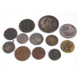 Twelve various 19th and early 20th century medals and medallions, including a Dutch naval example