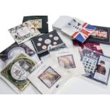 A collection of modern Royal Mint coin sets, including a 1998 and 1993 Deluxe set, nine uncirculated