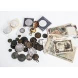 A small diverse collection of coins, including an 1890 crown, F, an 1813 Isle of man copper penny,