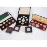 Three Royal Mail specimen coin sets, including a George VI 1950 nine coin example in red card box, a