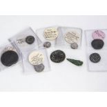 Eight Roman and antique coins, toegther with an ancient bronze arrow head, some of the coins well