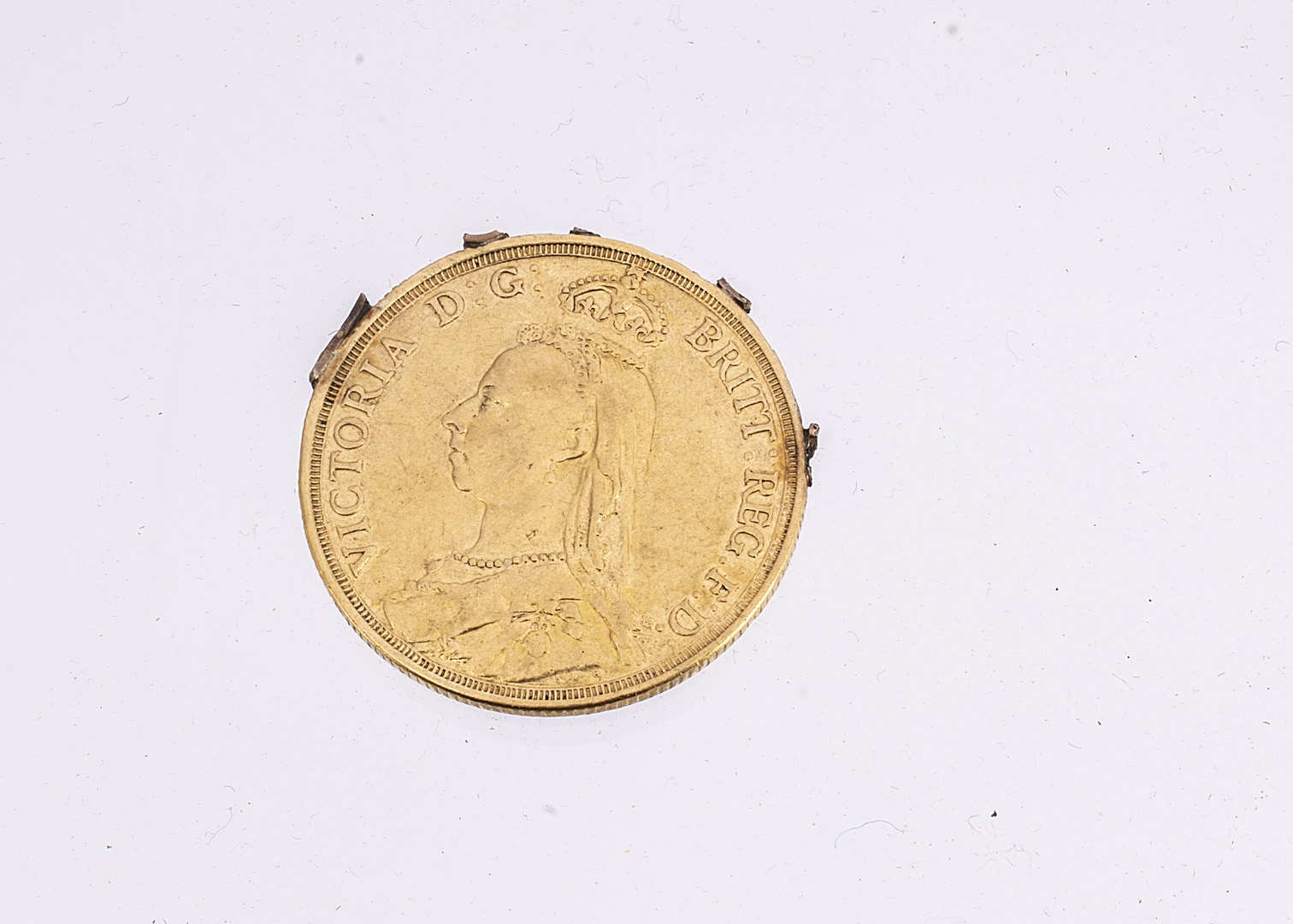 A formally mounted Victorian double sovereign style gold coin, the two pound style coin once