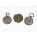 A small mixed lot of coins and medallions from around the world, sorted in small paper envelopes,