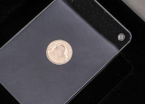A modern commemorative gold coin, similar to a quarter sovereign, dated 2015, 2g, in box