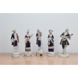 Five Royal Dux ceramic musician figurines, comprising, three male and two female examples all marked