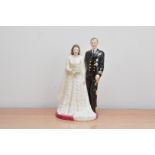 A limited edition Royal Doulton ceramic figurine, of Her Majesty Queen Elizabeth II and H.R.H.